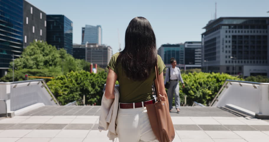 Walking, commute and back of businesswoman in city with travel or journey on stairs in morning. Steps, outdoor and professional female attorney with corporate career in urban town with route to work.