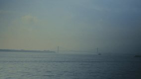 Atmospheric footage of the Verrazzano-Narrows Bridge emerging through dense morning fog over New York Harbor. Soft light, muted tones, and drifting mist create a calm, cinematic scene - Powered by Shutterstock - Get 15% off with code: PIKWIZARD15