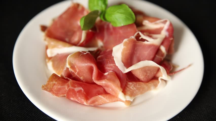 Meat jamon iberico or serrano snack fresh tasty food dish gourmet food background on the table rustic food top view copy space