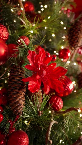 Bright red Christmas decorations with pine cones and sparkling lights. Christmas tree decorations concept.