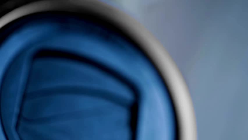 Rotate the camera lens to zooming in and out. camera with moving lens in macro. Diaphragm blades of the fixed camera lens opening and closing aperture.