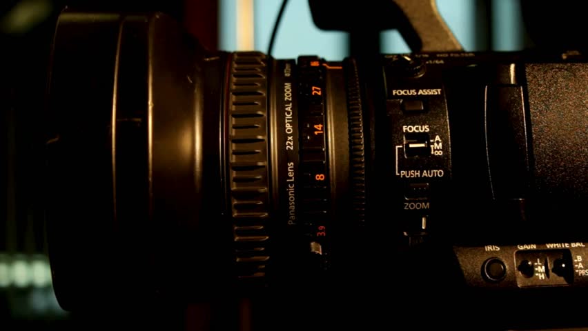 Photographer hand changing manual aperture ring on the camera lens. Lens camera manual focus. Changing exposure with aperture ring on manual lens.