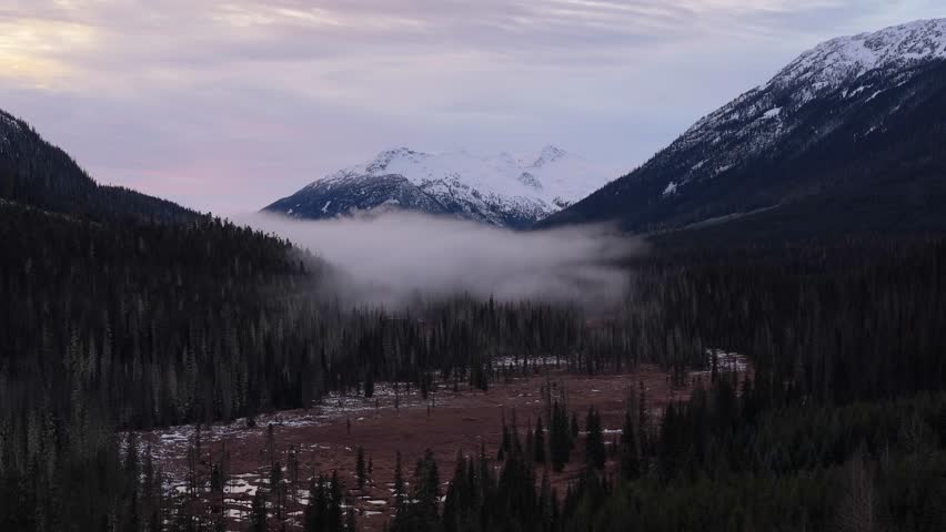 Majestic Fog-Filled Mountain Valley at Dawn in British Columbia, Canada