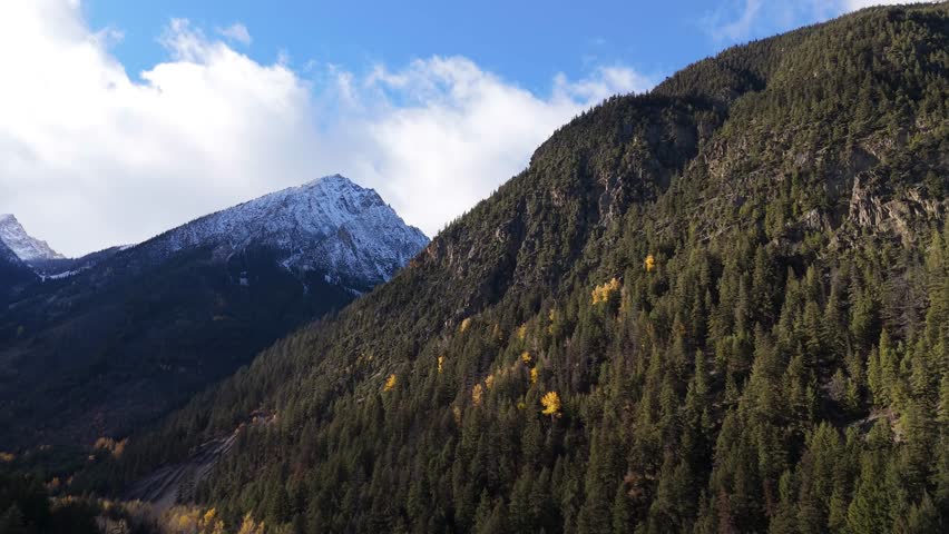 Majestic Autumn Mountains and Evergreen Forests with Snow-Capped Peak in British Columbia, Canada