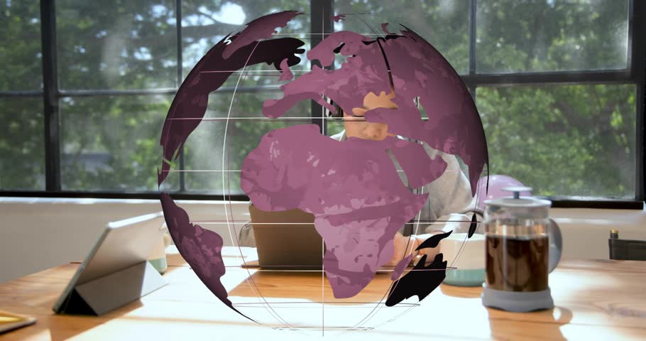 Male bringing plate initiating biz bash, female trying headset, globe centred over table, hugging. Collaboration, teamwork, celebration, office, workspace, sunny, window