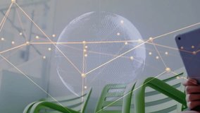 Boy shifting tablet into center, activating wireframe globe overlay while exploring educational app. Child, device, interactive, screen, edtech, classroom, green - Powered by Shutterstock - Get 15% off with code: PIKWIZARD15