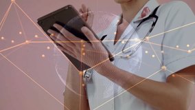 Female doc tapping tablet on pink set starting network overlay and viewing data with stethoscope. Healthcare, clinician, healthtech, telemedicine, touchscreen, globe, clinical - Powered by Shutterstock - Get 15% off with code: PIKWIZARD15