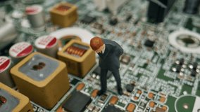 A Miniature Businessman Standing On A Detailed Green Circuit Board Inspecting Tiny Electronic Components, Captured In Real-Time Macro Footage. - Powered by Shutterstock - Get 15% off with code: PIKWIZARD15