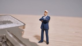 Miniature Businessman Figure Stands On House Keys, Representing Real Estate Investment And Ownership (Macro Shot). - Powered by Shutterstock - Get 15% off with code: PIKWIZARD15