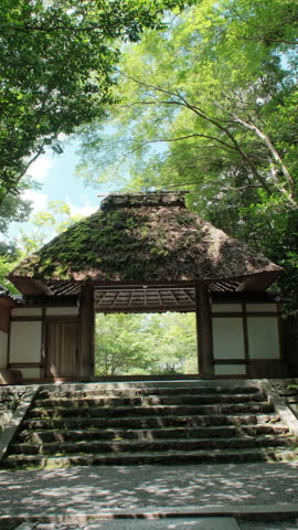 Japanese temple gate in summer surround by lush landscape, Honenin temple, Kyoto city, Japan.