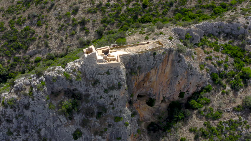 Aerial view of the ruins of the Ocaive Castle is a castle from the Muslim period of the 11th century, and is located on the Ocaive rock in La Marina Alta, Alicante, Spain.