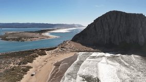A wide, cinematic panoramic motion scanning the entire coast, harbor, and iconic Morro Rock in one smooth movement. - Powered by Shutterstock - Get 15% off with code: PIKWIZARD15