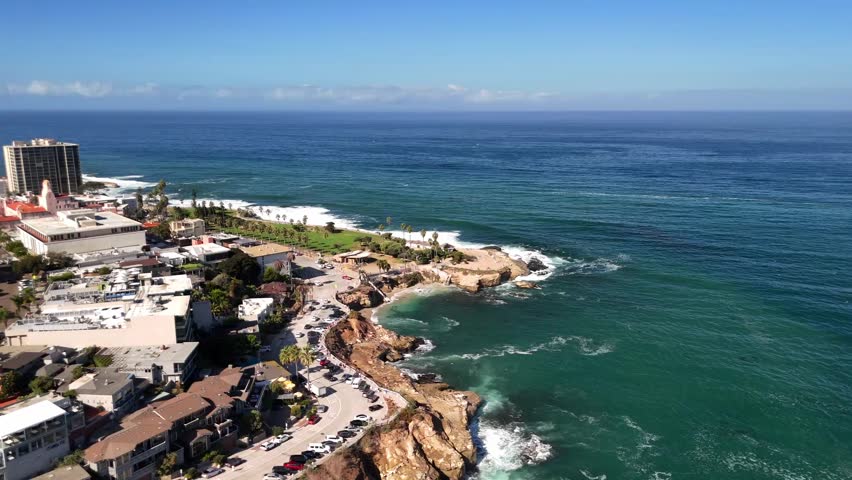 A high-angle pass revealing park areas and scenic viewpoints.