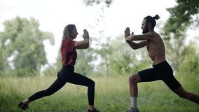 Couple Performing Warrior Yoga Pose. Exercising In Park. Partner Fitness And Wellness. Outdoor Yoga Session. Joint Exercise Routine Flexible Body. Shared Fitness Goal. Strength And Balance Yoga Class - Powered by Shutterstock - Get 15% off with code: PIKWIZARD15