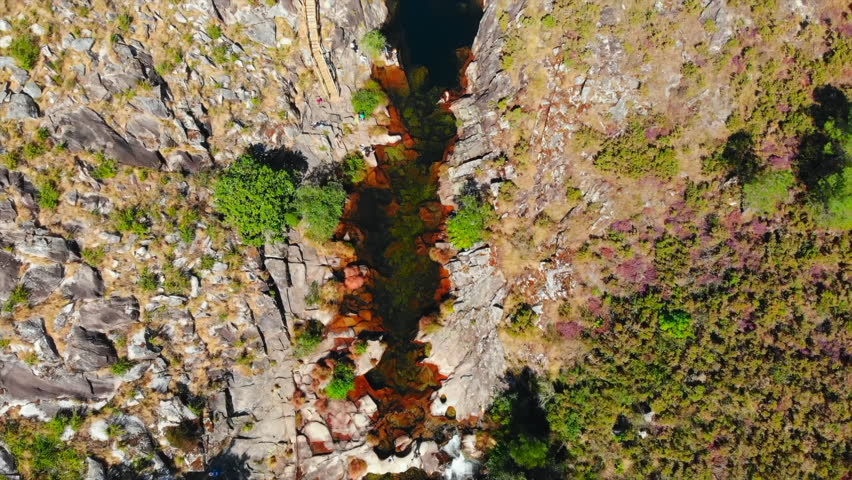 Aerial view of canyon river waterfall in mountain landscape. Media