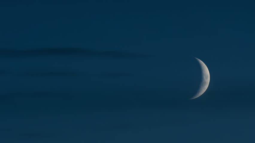 Close up of crescent moon illuminated against a deep blue sky