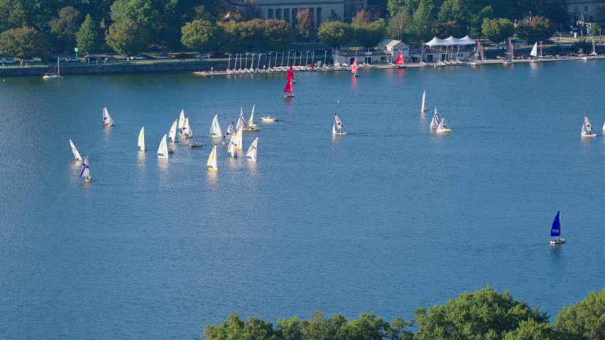 Charles River with rowing and boats sailing during the day in Boston, Massachusetts, USA, medium shot