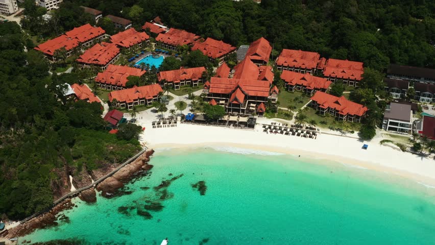 Aerial view of Long Beach with clear turquoise waters and Redang Island resort. Malaysia