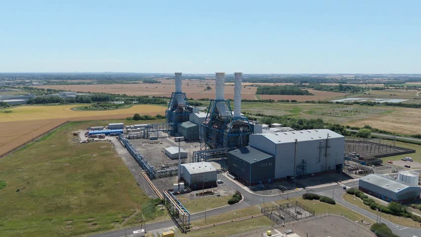 Aerial drone view of Humber South Bank power plant near Immingham UK with gas and oil energy generation, industrial smoke stacks on a sunny day. 