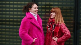 Women enjoying conversations in fresh air, chatting animatedly in city, enjoying winter day, smiling happily. Concept of friendship and communication - Powered by Shutterstock - Get 15% off with code: PIKWIZARD15