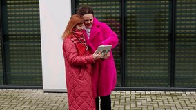 Women enjoying conversations in fresh air, chatting animatedly in city, enjoying winter day, smiling happily. Concept of friendship and communication - Powered by Shutterstock - Get 15% off with code: PIKWIZARD15
