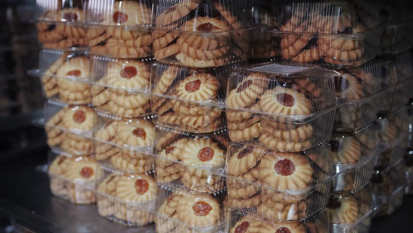 Packaged shortbread cookies on a supermarket shelf. Bakery production