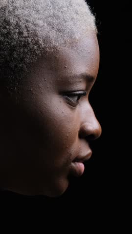 Dramatic Side Profile of Smiling African American Woman