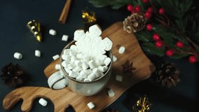Warm mug of hot chocolate with marshmallows and snowflake cookie decorated for winter celebration - Powered by Shutterstock - Get 15% off with code: PIKWIZARD15