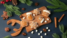 Christmas gingerbread cookies on wooden board with pine branches and cinnamon sticks - Powered by Shutterstock - Get 15% off with code: PIKWIZARD15