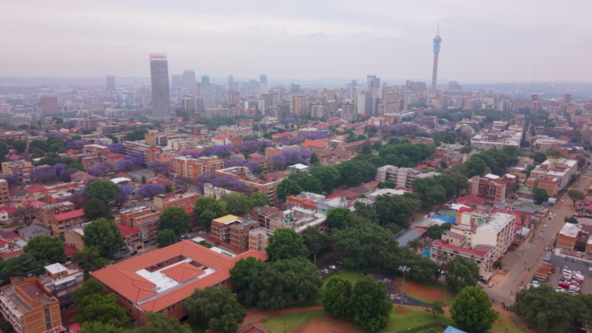 Wide aerial view of the city of Johannesburg and Hillbrow on an overcast morning.