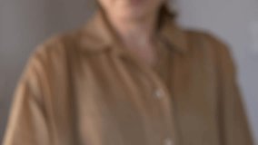Woman holds out a keychain with house keys, symbolizing a new home, purchase, or rental agreement. Closeup shot focuses on the hand and keys, capturing a clean, bright moment of real estate transition - Powered by Shutterstock - Get 15% off with code: PIKWIZARD15