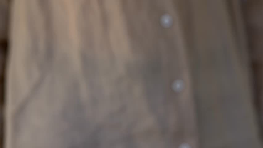 Woman holds keychain with house keys, symbolizing buying, renting, or receiving new property. Soft indoor lighting and warm tones highlight emotional moment of transitioning into new home. House keys. - Powered by Shutterstock - Get 15% off with code: PIKWIZARD15