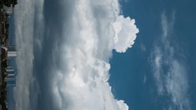 Vertical video - Timelapse of dark thick storm clouds covering the blue sky - Powered by Shutterstock - Get 15% off with code: PIKWIZARD15