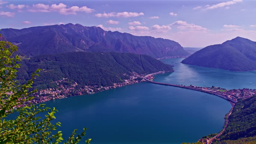 Lugano, Switzerland – October 27, 2022: Panoramic view from Monte San Salvatore overlooking Bissone, Monte San Giorgio and Monte Generoso across Lake Lugano.