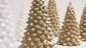 Gold and white glitter trees arranged studio still life sparkling texture modern centerpiece soft lighting. Christmas decoration. New Year 2026 - Powered by Shutterstock - Get 15% off with code: PIKWIZARD15