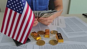 Counting cash and examining gold and cryptocurrency on a table with an American flag - Powered by Shutterstock - Get 15% off with code: PIKWIZARD15