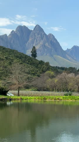 Car driving through a scenic landscape in Stellenbosch, Western Cape, South Africa.
