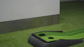 Indoor Golf Putting Practice with Mixed Results - Powered by Shutterstock - Get 15% off with code: PIKWIZARD15