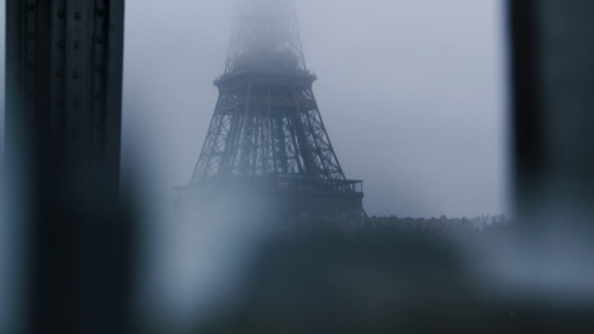 The Eiffel Tower disappearing  in Clouds of winter