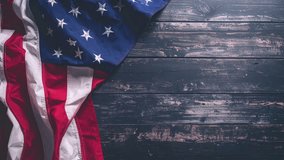 Animated 'Thanks You Veterans' text with a glowing effect on a rustic wooden background, featuring a draped American flag. Perfect for patriotic holidays and honoring military service. - Powered by Shutterstock - Get 15% off with code: PIKWIZARD15