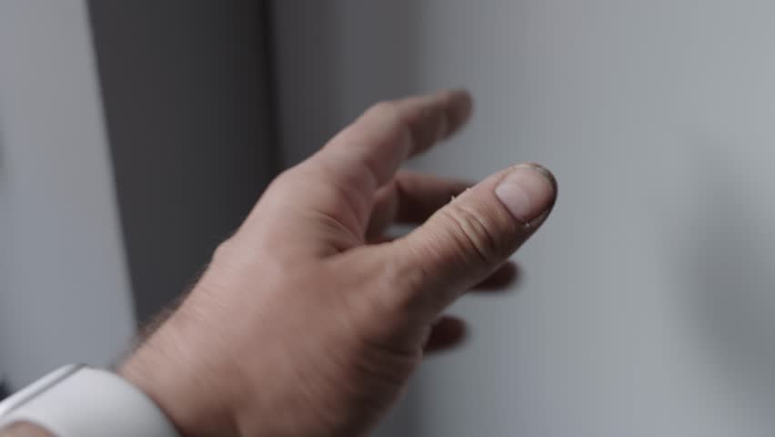 A male hand with rough, dirty skin and damaged nails from hard manual labor. Concept of physical work, endurance, and occupational health