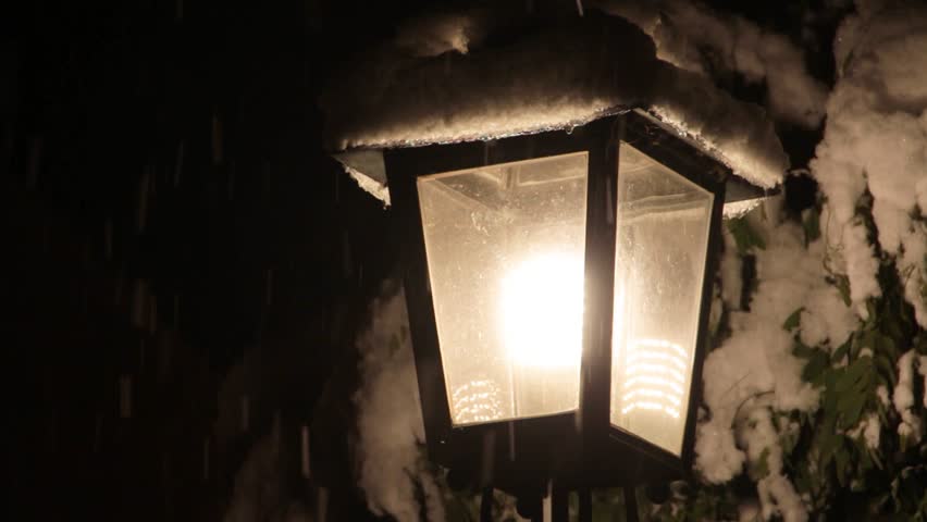 The street light in the snow, branches in the snow, heavy snowfall on the central square in city of Moosburg an der Isar, Bavaria, Germany, 1 December 2023