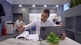 Diverse group of business colleagues collaborates effectively in a contemporary coworking office space. They work diligently on their projects, highlighting a positive and productive team environment. - Powered by Shutterstock - Get 15% off with code: PIKWIZARD15