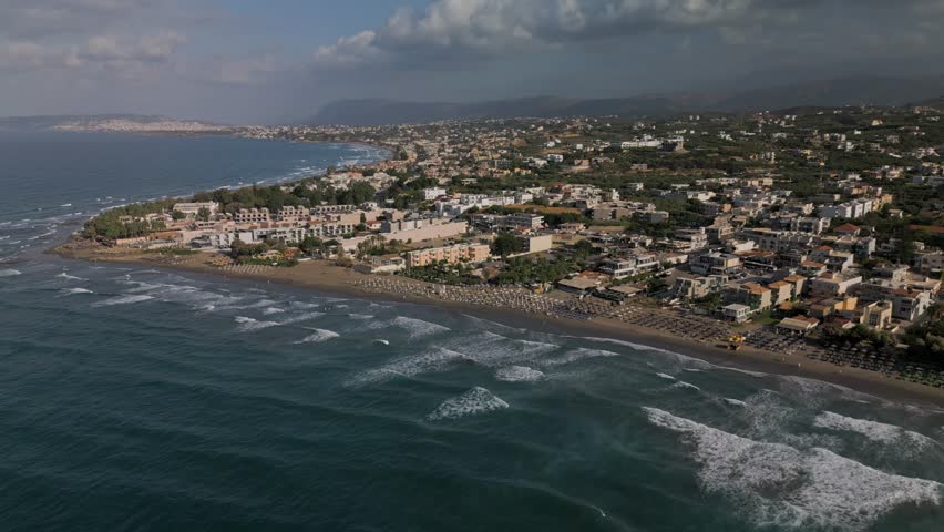 Aerial, panoramic view of the northern coast of the island of Crete near the town of Agia Marina and Platanias, Crete, Greece