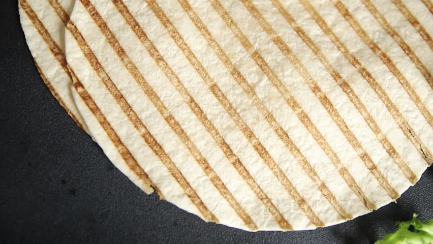 Lavash grill flatbreads tortilla ready to eat tasty snack fresh gourmet food background on table rustic food top view copy space