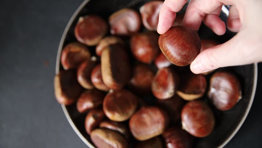 Chestnuts edible fruit treat tasty snack fresh gourmet food background on table rustic food top view copy space