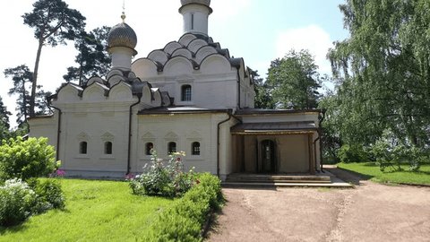 Drone Rising over Traditional Domed Building Forested