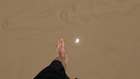A man's point of view walking on a beach in Porto Belo, Brazil on a summer day. - Powered by Shutterstock - Get 15% off with code: PIKWIZARD15