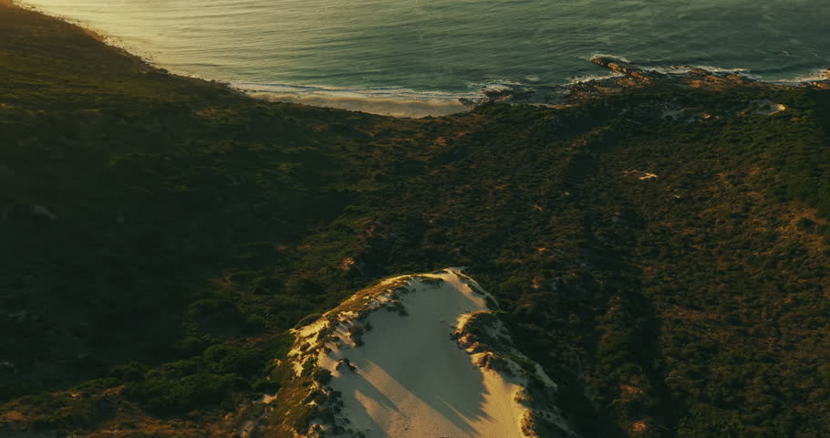 Drone, landscape and sea with location in nature or wilderness for adventure and hiking trail. Aerial, ocean and view with outdoor scenery of mountains for ecology, environment or peaceful travel