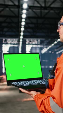 Vertical Video Isolated mockup with technician coordinating strong labor involvement in industry plant, heavy production workflow essential to modern manufacture inside the industrial environment